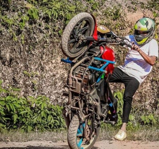 Krishnajeev TR Performing a stunt on his Motorcycle