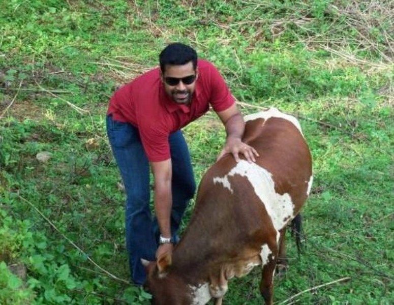Pradeep Chandran with a Cow