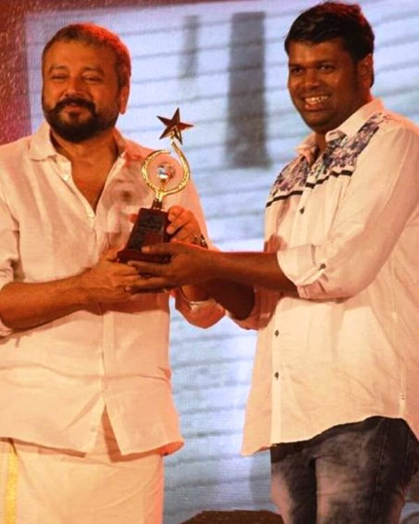 Saju Navodaya Receiving an Award