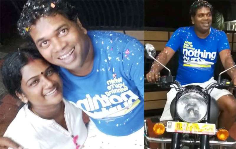 Saju Navodaya with His Wife and Motorcycle