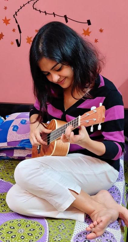 Solanki Roy playing Ukulele