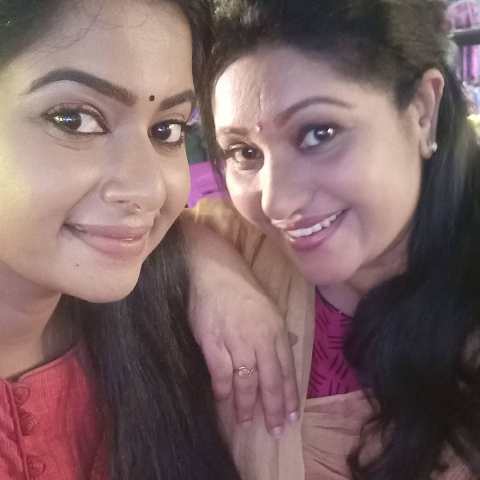 Thesni Khan with her sister