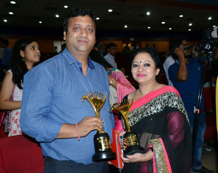 Young Uttarakhand Cine Award Posing with her Husband and Young Uttarakhand Cine Award