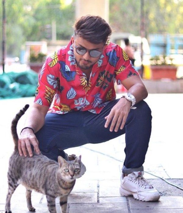 Awez Darbar with a Cat