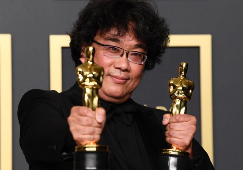 Bong Joon-ho Posing with his Oscars
