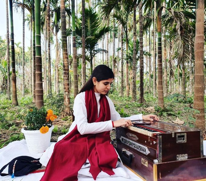 Devi Chitralekha Playing the Harmonium