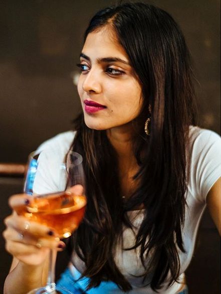 Malavika Mohanan enjoying wine