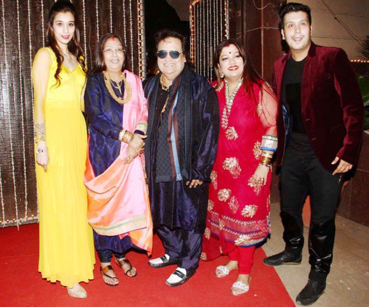 Bappi Lahiri With His Son, Daughter, Wife, and Daughter-in-law (from left)