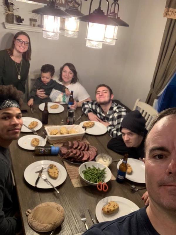 Brian Eisch at a dinner party with his family and friends