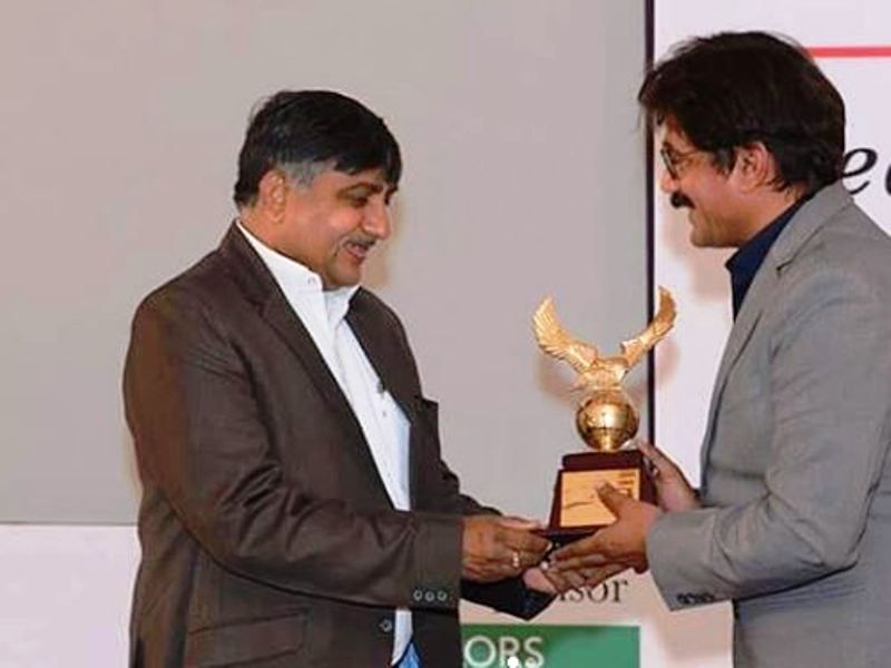 Prateek Trivedi Receiving an Award