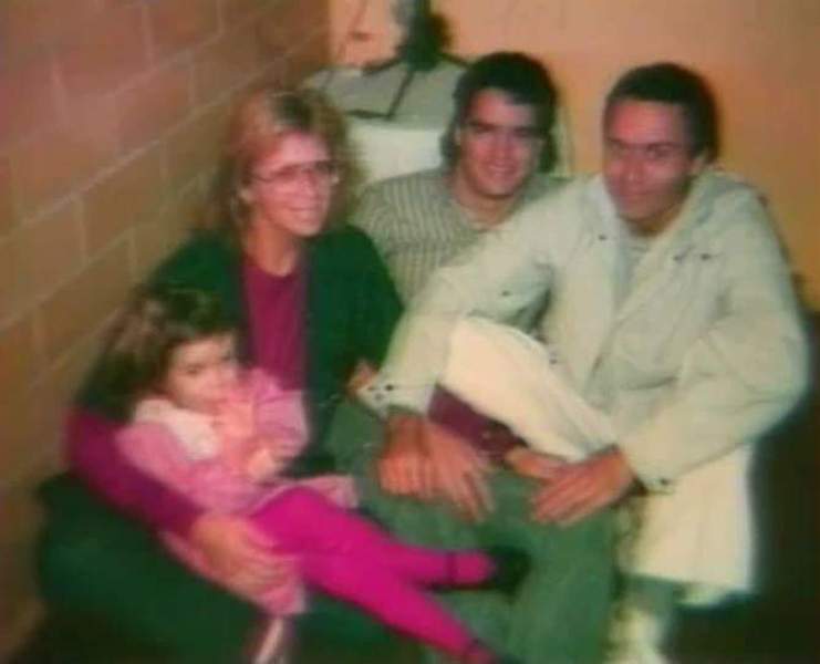 Ted Bundy (right) and Carol Anne Boone (holding Rose Bundy in her lap)