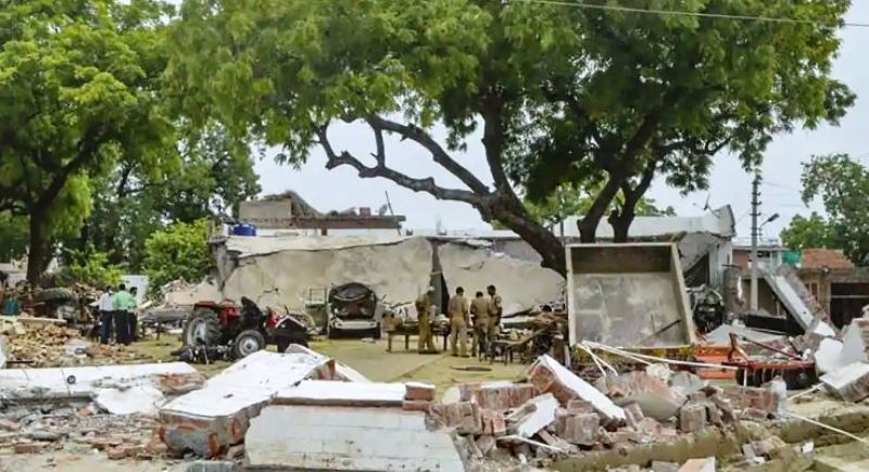 Debris lie on the ground after demolition of the house of gangster Vikas Dubey, in Kanpur