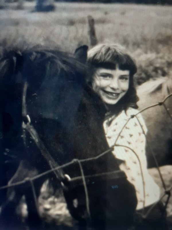 Tara Reade Playing With a Horse