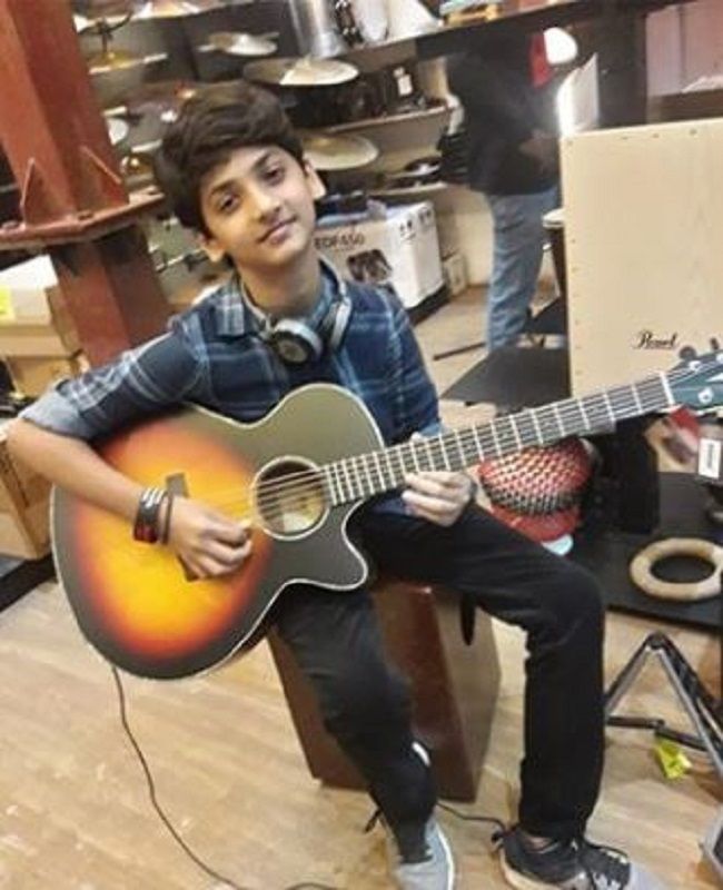 Varin Roopani Playing Guitar