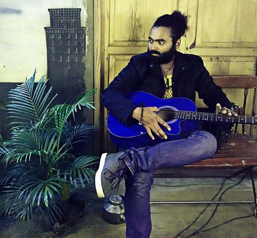 Raghu Playing the Guitar