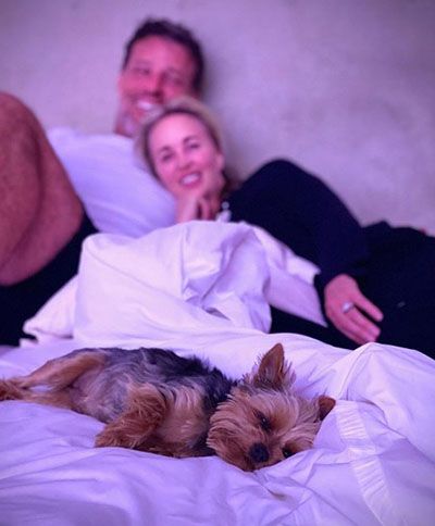 Sage Robbins and her husband with their dog