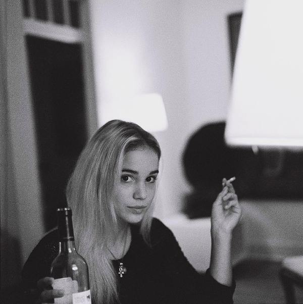 Alba Baptista enjoying a drink while smoking