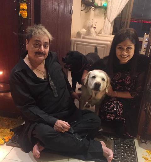 Dolly Minhas with her husband and pet dogs