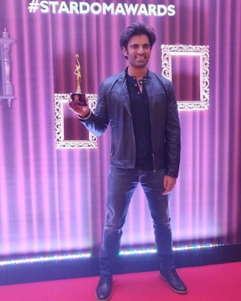 Mohit Malik with an award