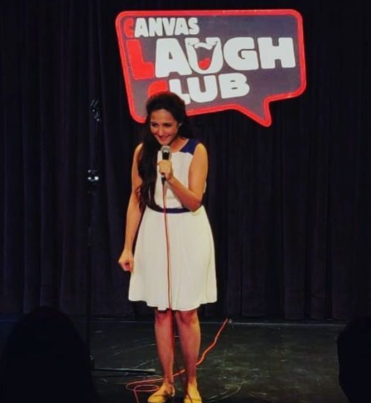Pooja Ruparel doing stand-up comedy