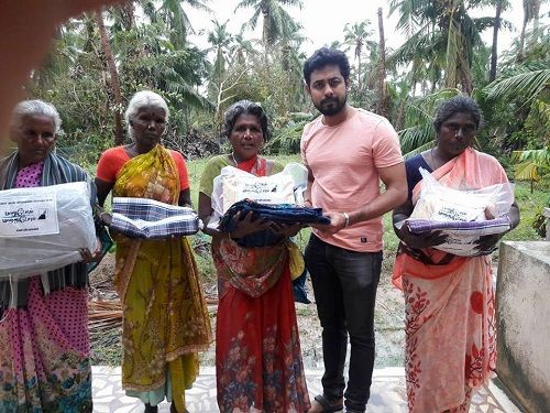 Aari Arjuna Distributing Clothes to Poor Families