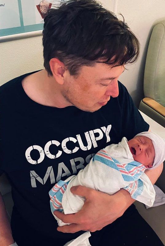 Elon Musk with his and Grimes' Son