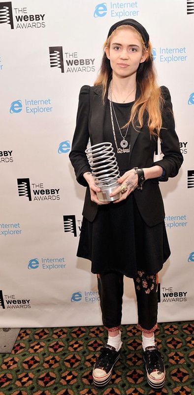 Grimes with her Webby Award