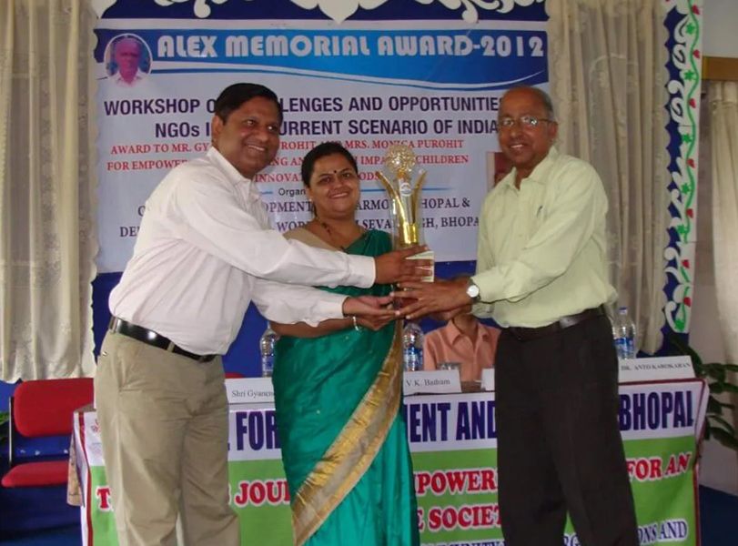 Monica and Gyanendra Purohit Receiving Alex Memorial Award