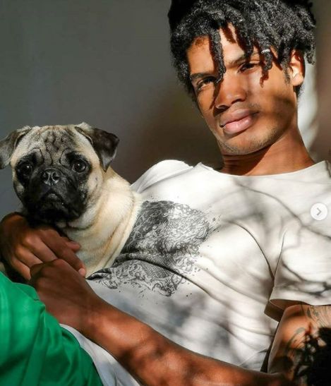 Michael Ajay with his pet dog