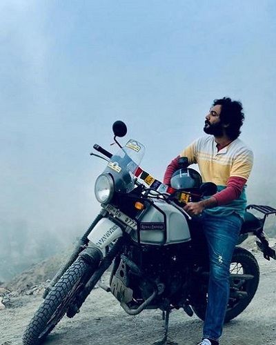 Siddu Jonnalagadda Posing With His Motorcycle