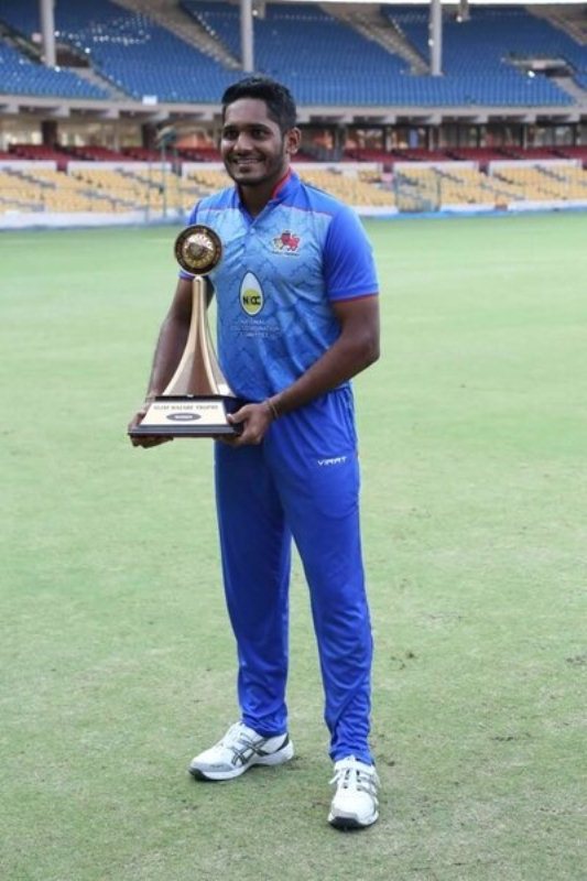 Tushar Deshpande with the Vijay Hazare Trophy after winning the final match