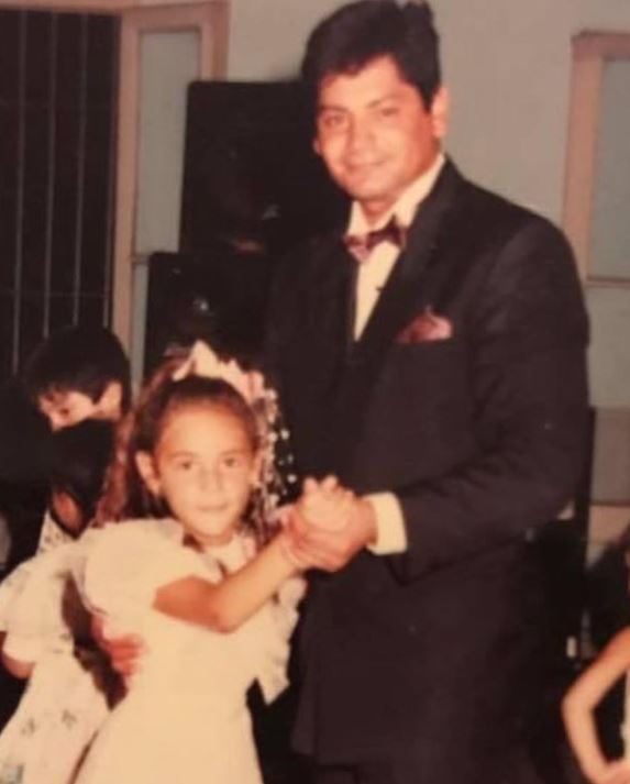 A childhood picture of Rocio Oliva with her father