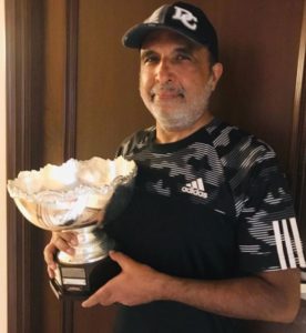 Sanjay Jha posing with his Runners Up trophy he won at the Willingdon Club Memorial Tennis Tournament 2019