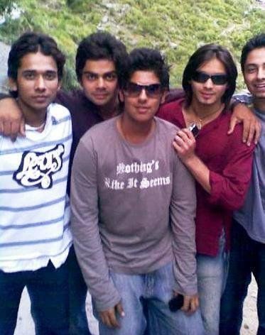 Long-haired young Tejashwi Yadav (second from right in red shirt) along with Virat Kohli (second from left) and his cricket mates