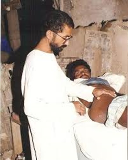 Dr. Ravindra Kolhe treating a patient in the village