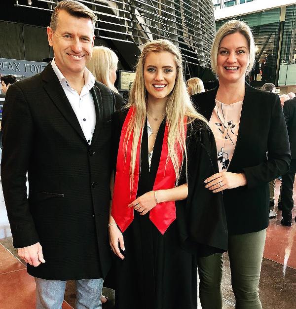 Mia Healey with her parents