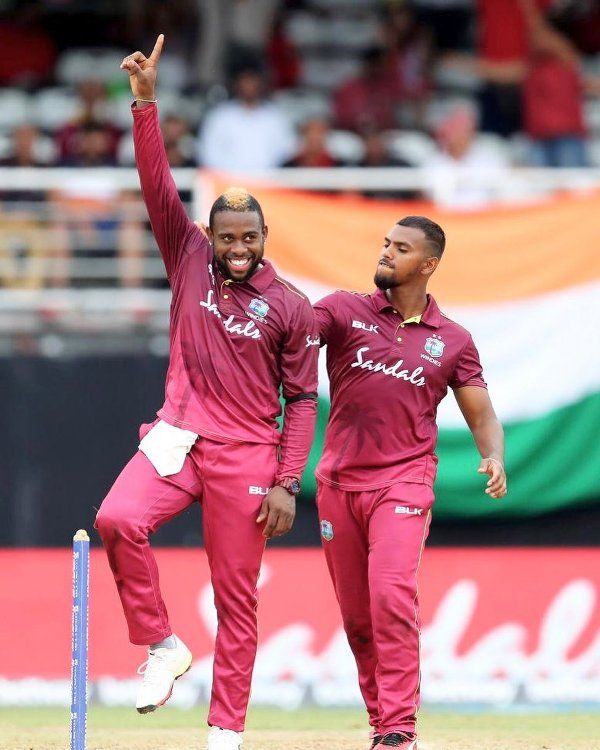 West Indian cricketer Fabian Allen raising his hand with joy after taking a wicket