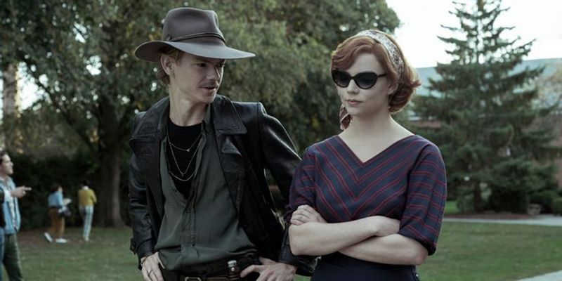 Beth Harmon (played by Anya Taylor-Joy) with Benny Watts (played by Thomas Brodie-Sangster) in a scene from The Queen's Gambit (2020)