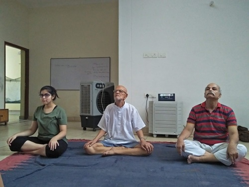 H. C. Verma (right) doing yoga with his brother and daughter