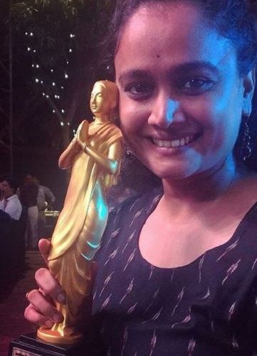 Kalyanee Mulay holding her award