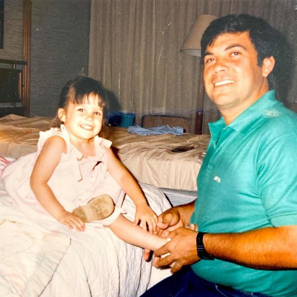 Childhood picture of Lacey Chabert with her father