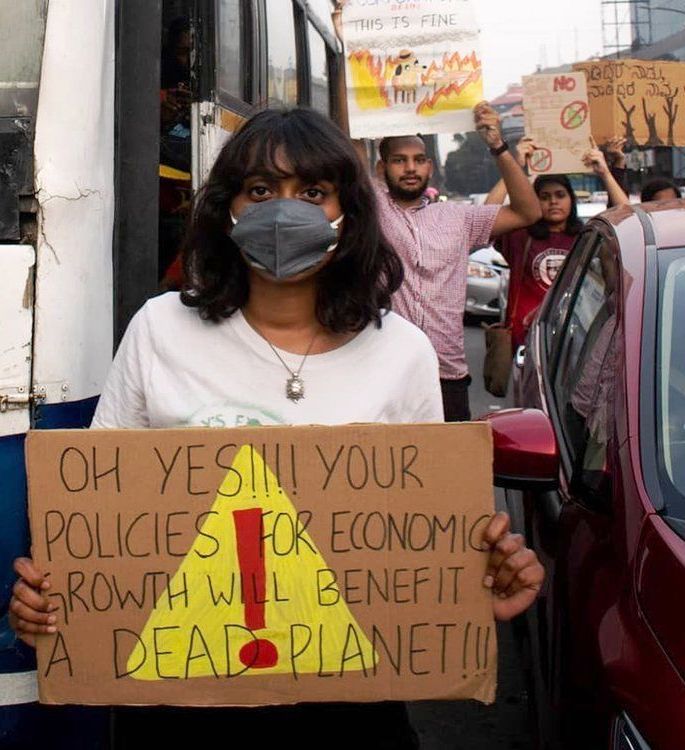Disha Ravi displaying a placard warning about climate change during a protest held in Banglore
