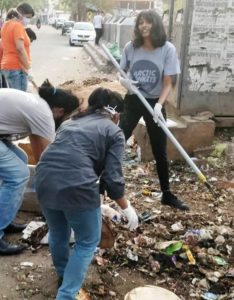 Disha Ravi lending a hand in cleaning garbage in her city