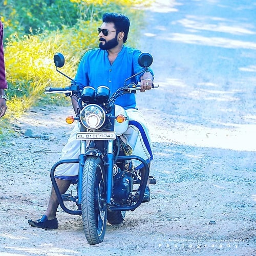 Firoz Azeez posing on his motorcycle