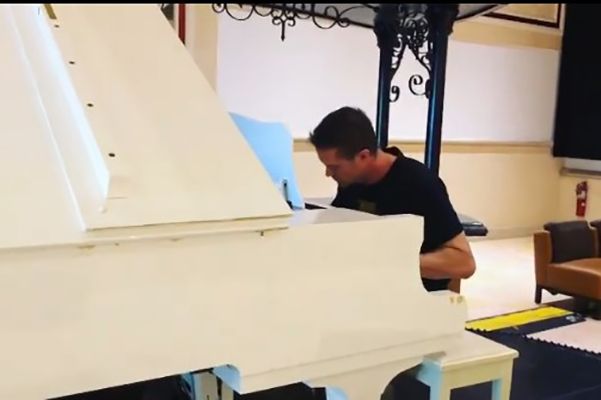 Garrent Dillahunt playing the piano