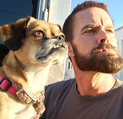 Garret Dillahunt posing with a dog
