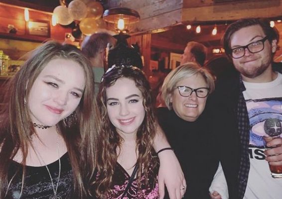 Mary Mouser with her mother and siblings