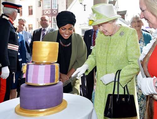 Queen Elizabeth 2 cutting the cake on her 90th birthday which was baked by Nadiya Hussain