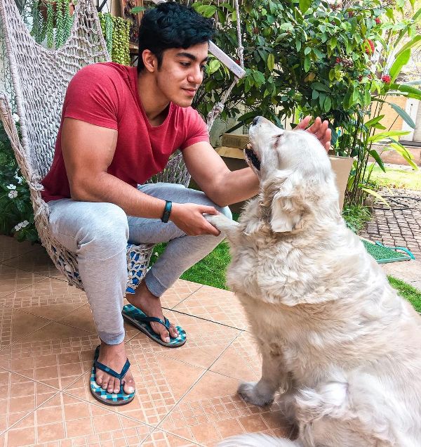 Saket Gokhale playing with a dog