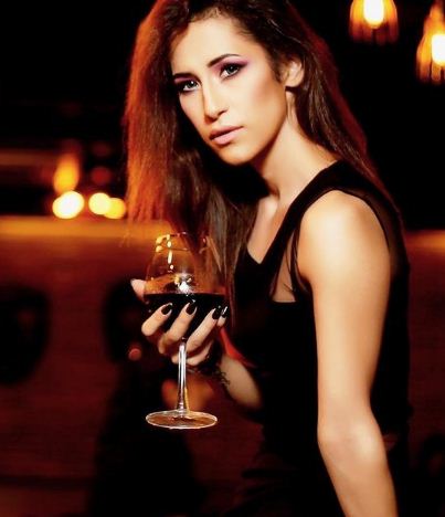 Aditi Rajput holding a glass of wine